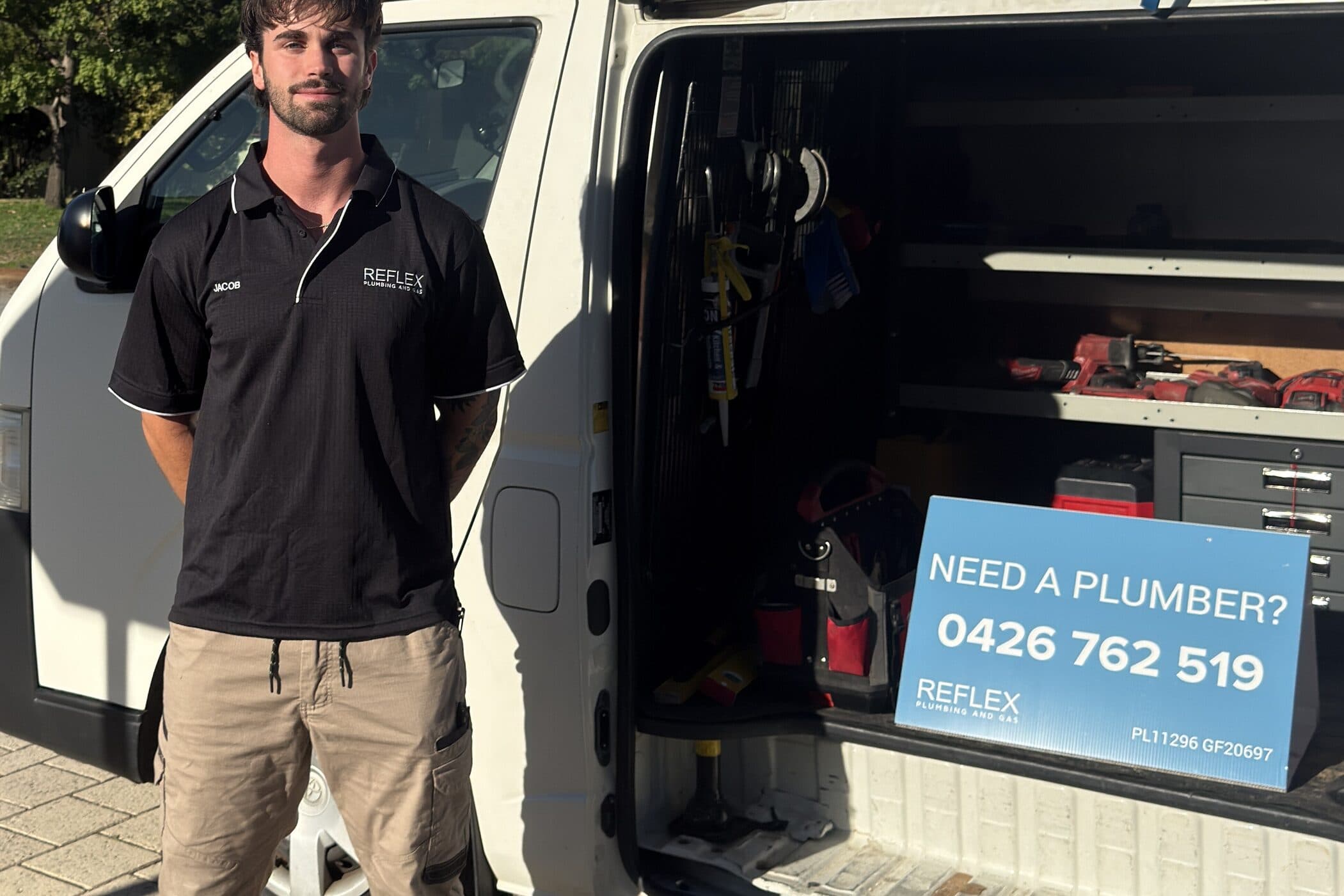 The signwritten Reflex Plumbing and Gas van