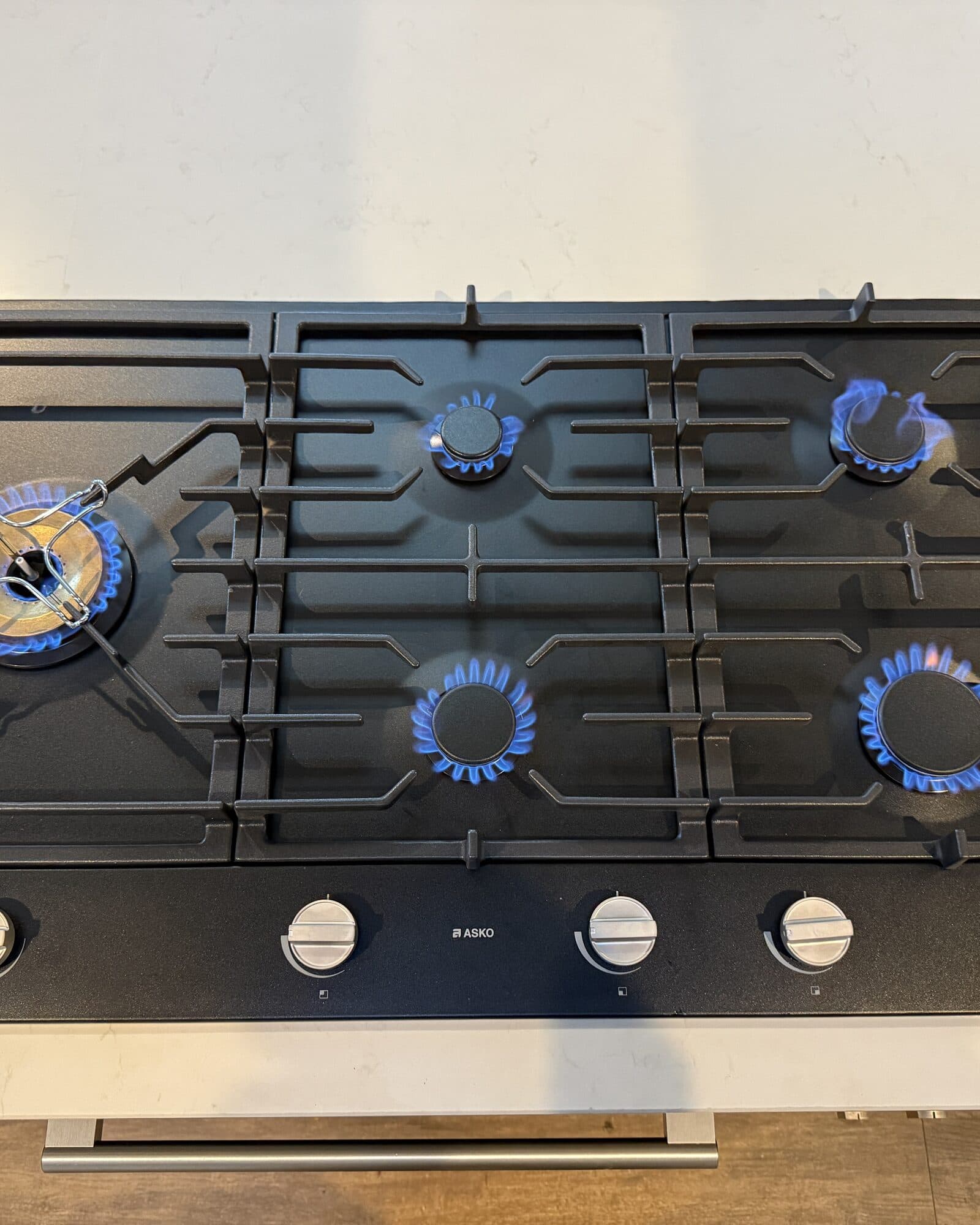 A gas cooktop connected and tested by a licensed gas fitter